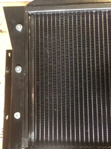 Fixing bracket first bolted to the radiator.